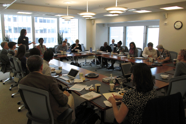 Meeting in a conference room for the Sandy Breakfast Series in 2013
